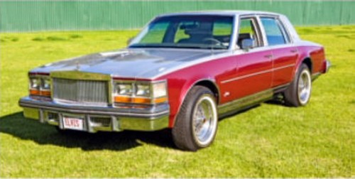 Elvis maroon and silver Cadillac Seville
