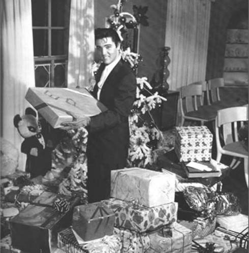 Elvis celebrating Christmas at Graceland in 1957